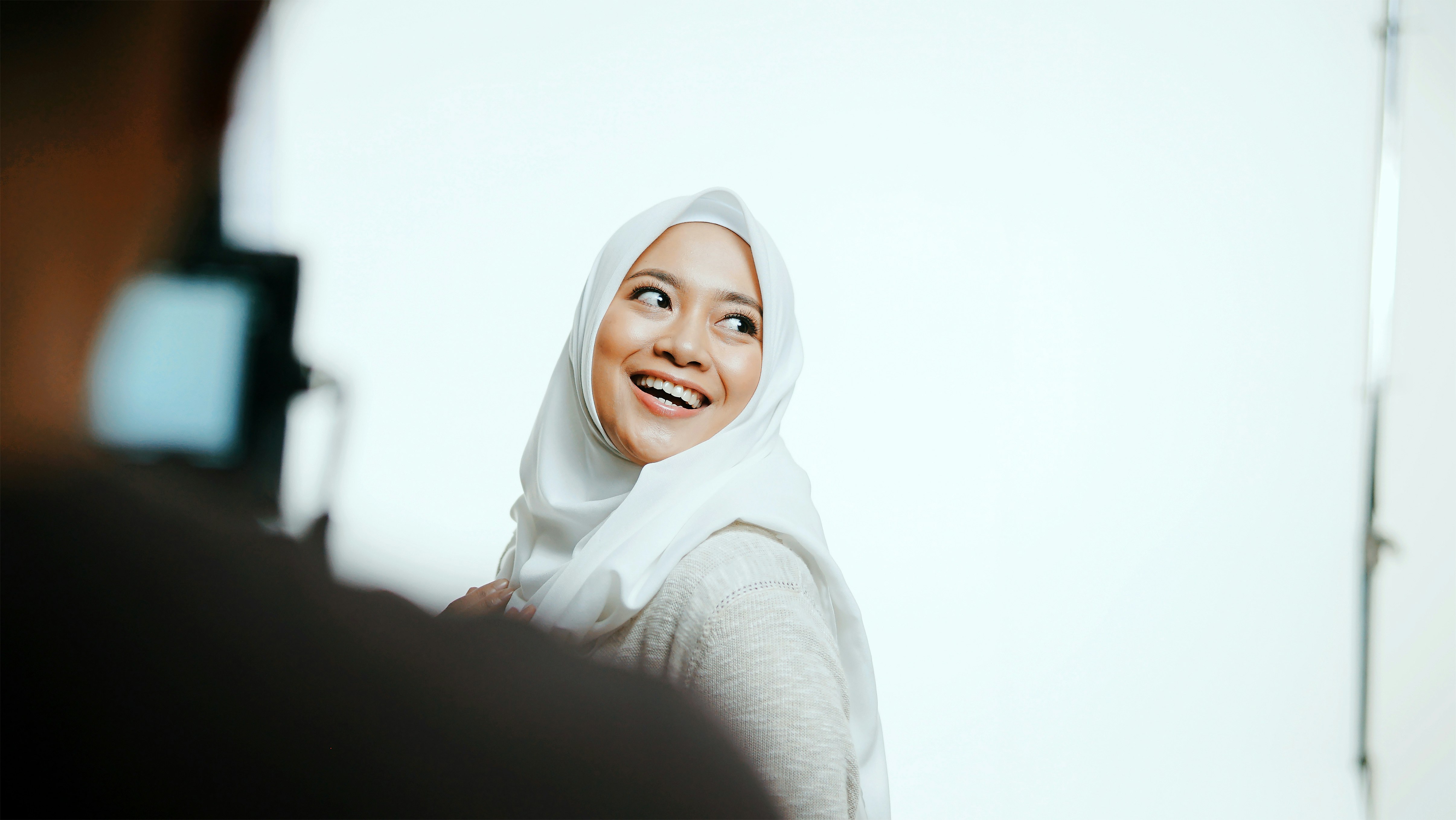 woman in white hijab and black long sleeve shirt
